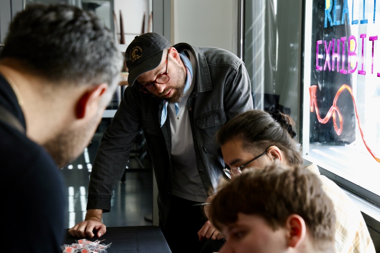 People discussing an exhibition